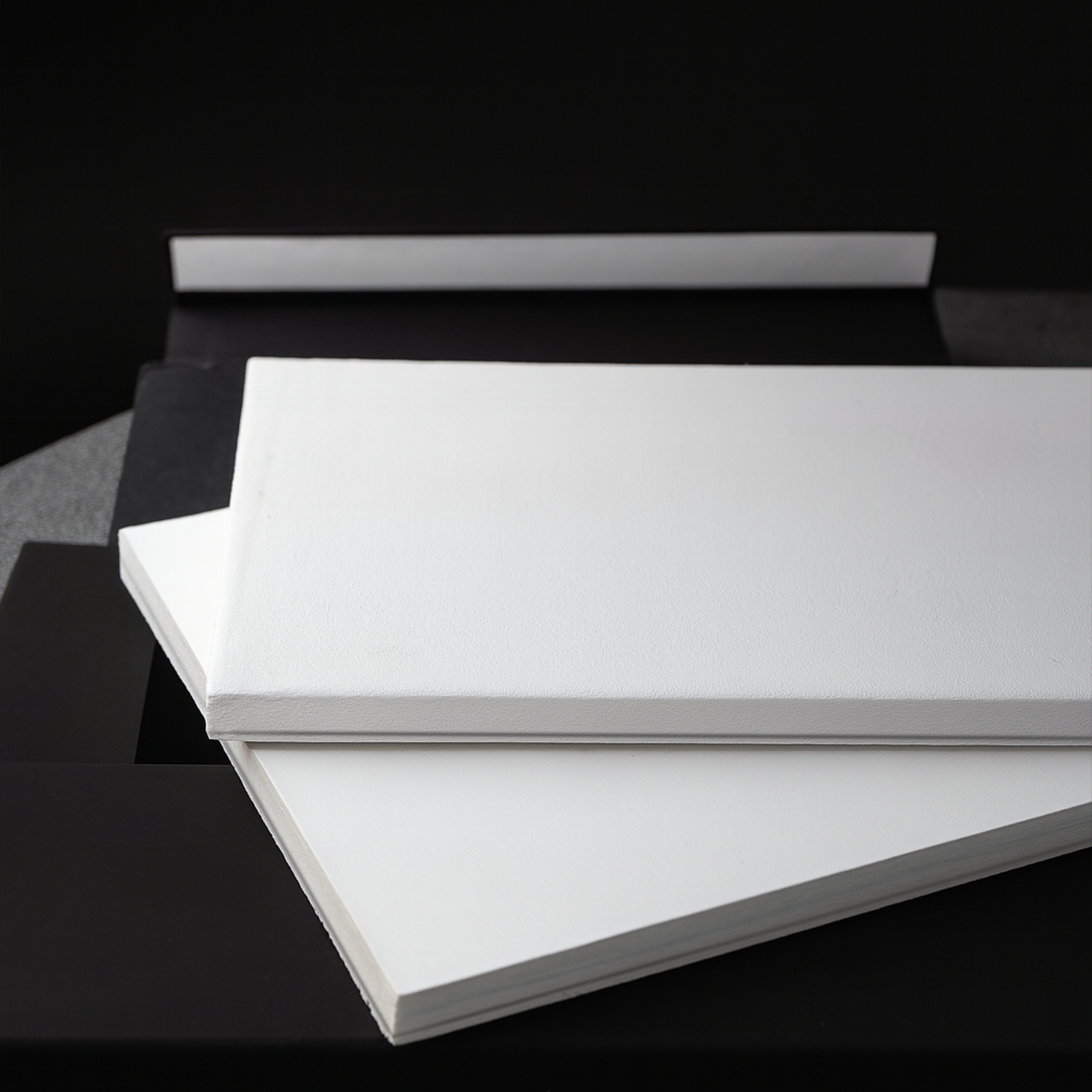 White foam board inserts used inside PullShield sleeves to protect graded trading card slabs during shipping.